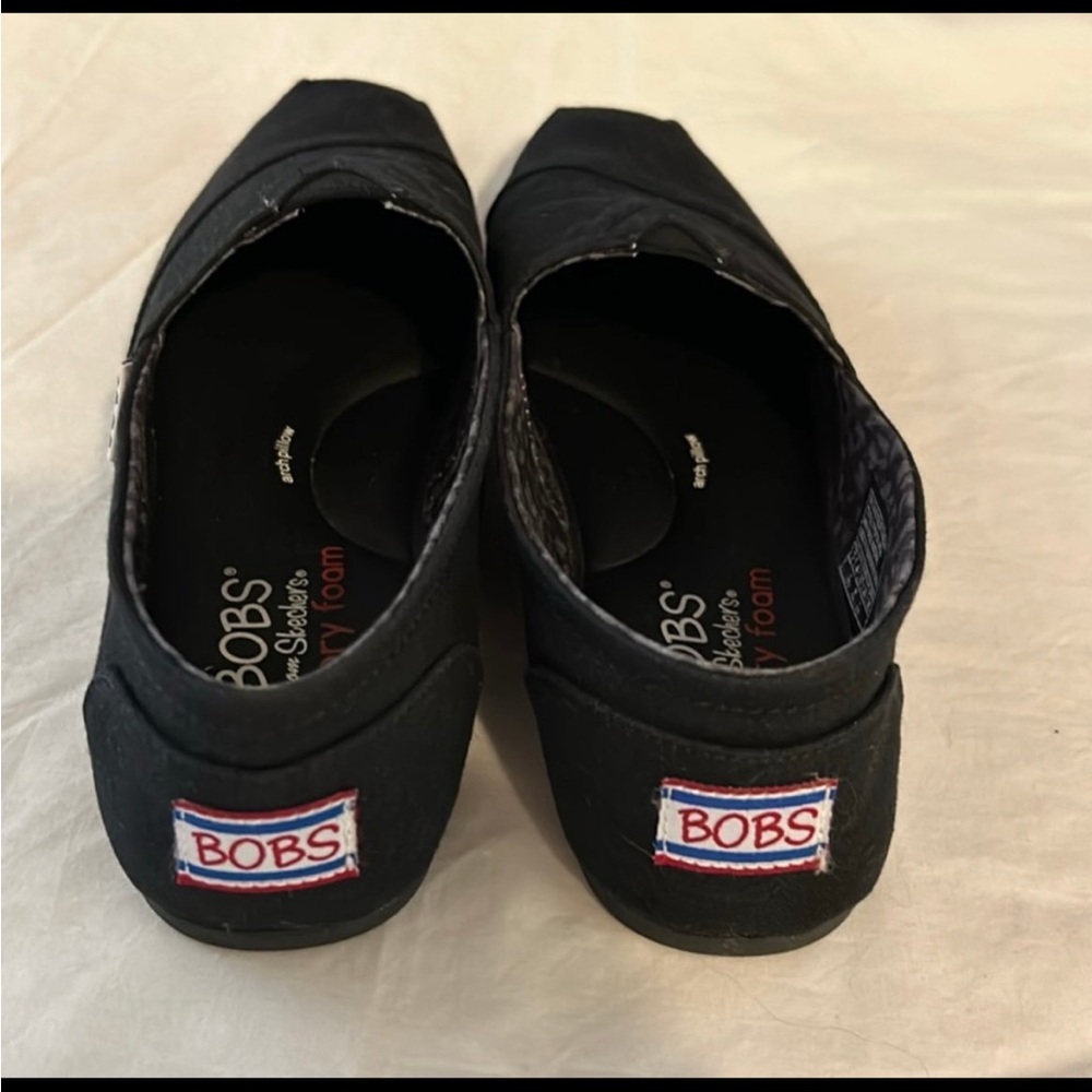 Skechers BOBS women’s Black Slip-On Slippers